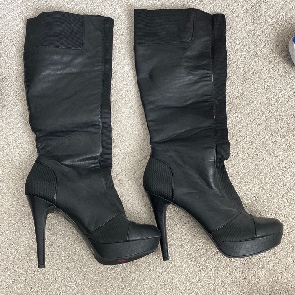 Black knee high boots.